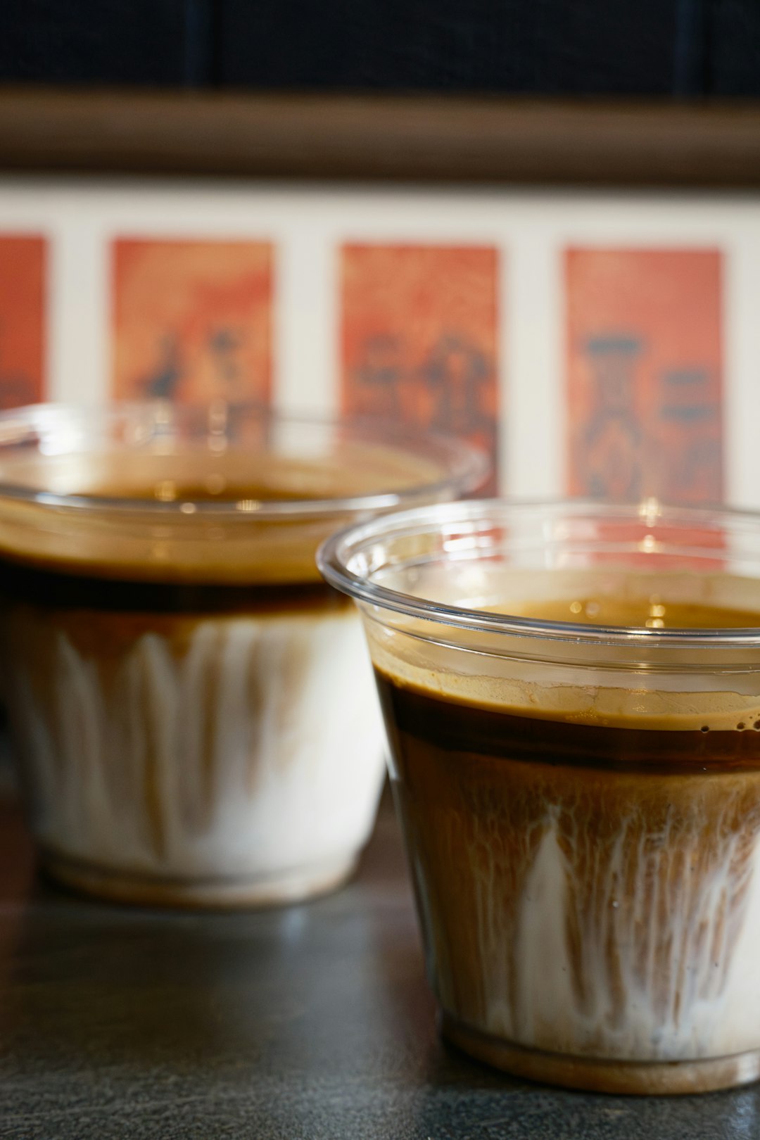 two-layered-coffee-drinks-in-clear-cups-1lbjeqfehqm